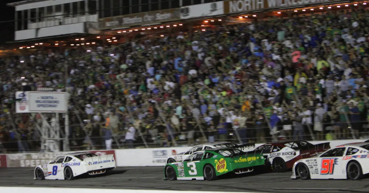 Race car on track under lights